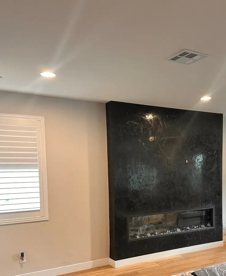 Black mineral plaster fireplace wall, master's work