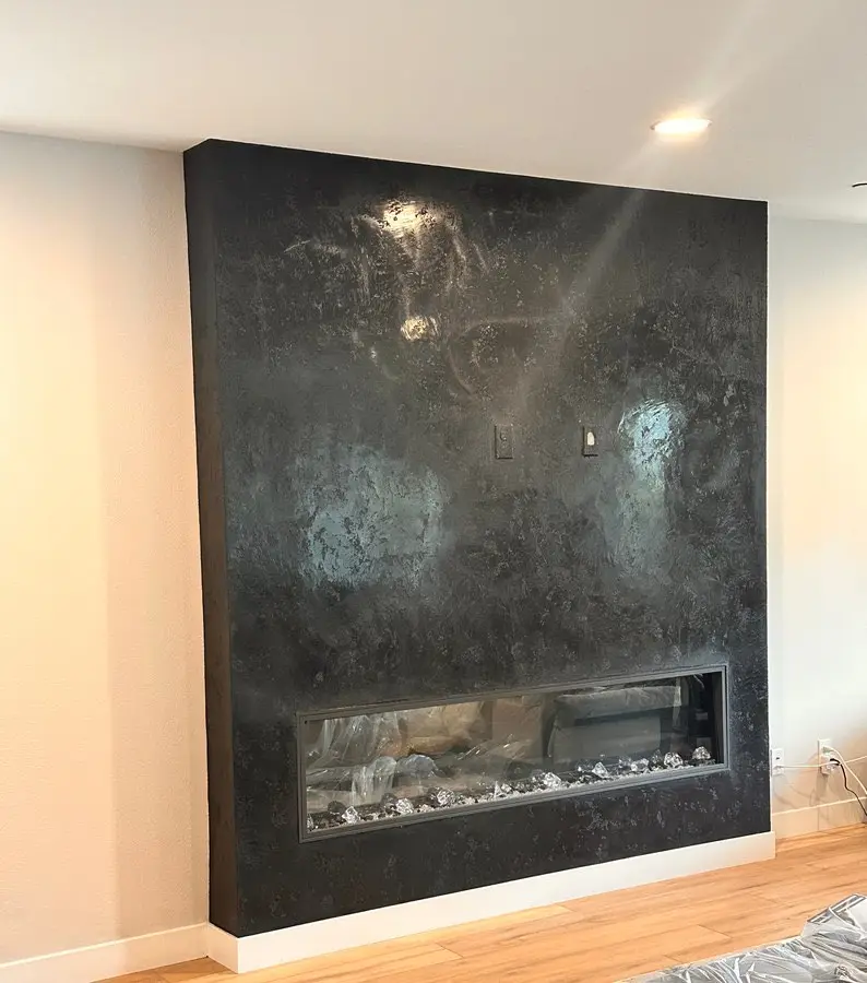 Black mineral plaster fireplace wall, master's work, USA