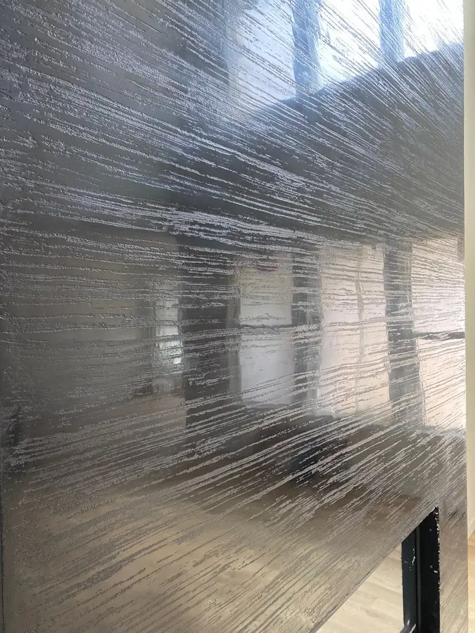 Venetian plaster with combed silver lines · close-up, master's work, USA