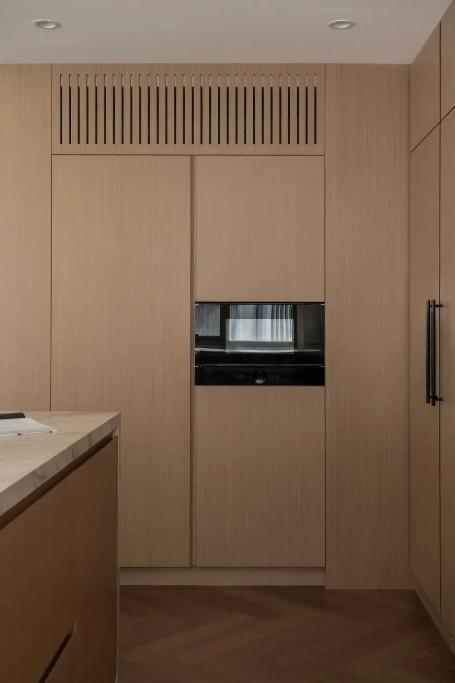 Tall oak cabinet tower with a built-in oven