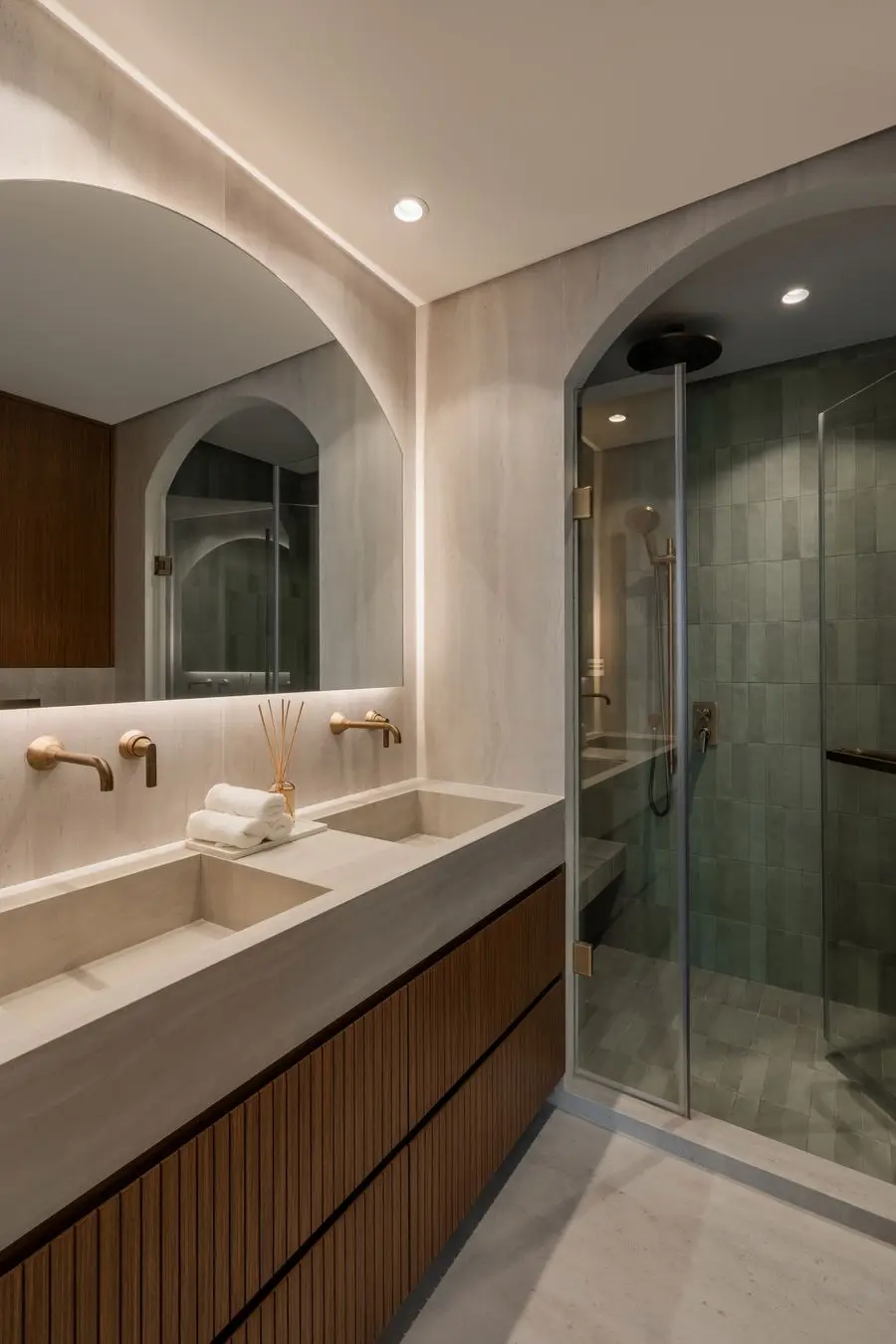 Bathroom with an arched shower door and a wall-hung vanity
