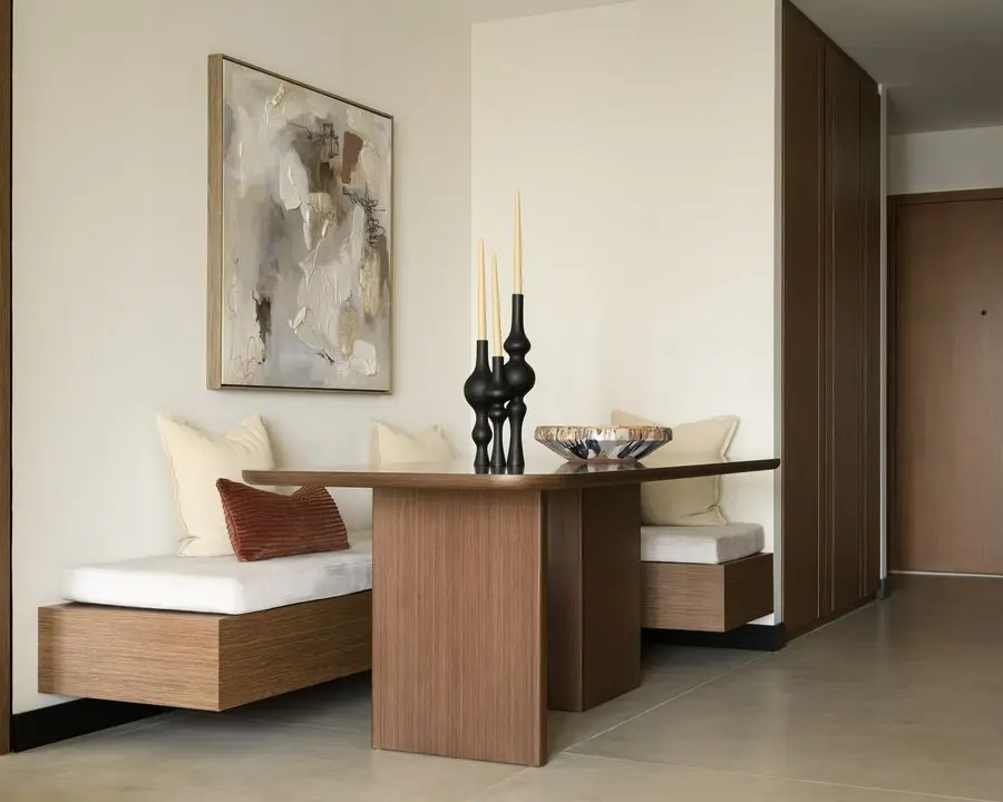 Built-in banquette with a walnut dining table