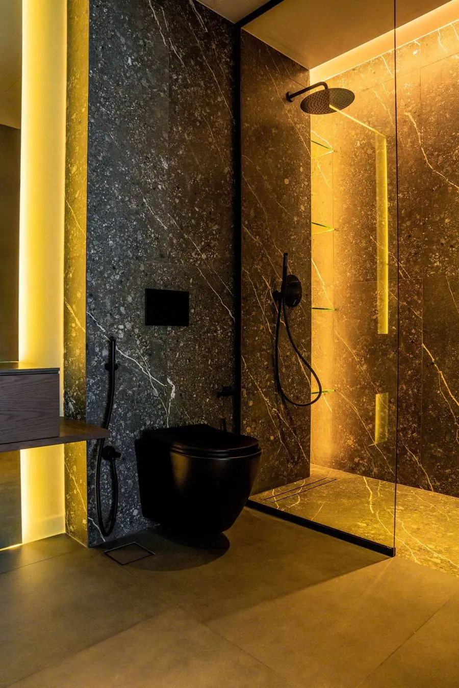 Bathroom with a backlit veined stone wall, black WC and rain shower