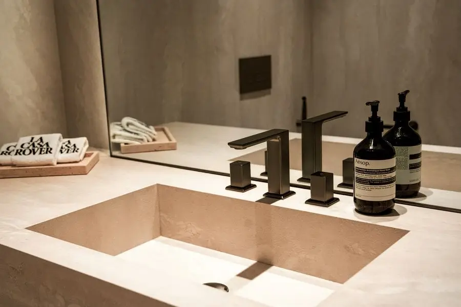 Integrated stone basin with black taps