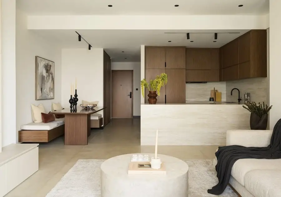 Open-plan living room with a stone kitchen island